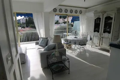 a living room with a couch and a table at La Reale in Villefranche-sur-Mer