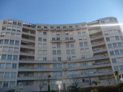 an apartment building in front of a blue sky at Chambre chez l'habitant Nice Baie des Anges in Nice