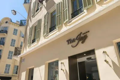 a building with a sign on the side of it at The Jay Hotel by HappyCulture in Nice