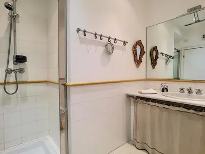 a bathroom with a shower and a sink and a mirror at Nestor&Jeeves - PALAIS NICOLE - Central - Very close sea in Nice