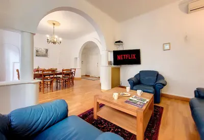 a living room with blue chairs and a table at Nestor&Jeeves - MEYERBEER - Central - Very close sea in Nice
