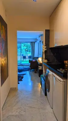 a kitchen with a washer and dryer in a room at Saint Jean Cap Ferrat in Saint-Jean-Cap-Ferrat