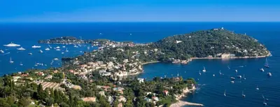 an island in the ocean with boats in the water at Saint Jean Cap Ferrat in Saint-Jean-Cap-Ferrat