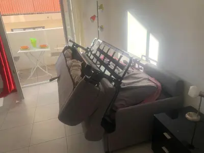 a living room with a couch and a table at Appartement Fodéré 2 in Nice