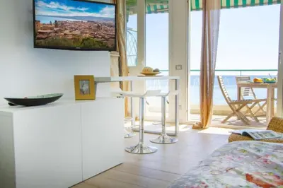 a living room with a tv on the wall at MY CASA - PROM 13 - Sea View - Promenade des Anglais - Terrace in Nice