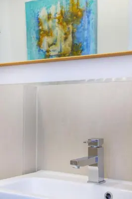 a sink in a bathroom with a painting on the wall at MY CASA - PROM 13 - Sea View - Promenade des Anglais - Terrace in Nice