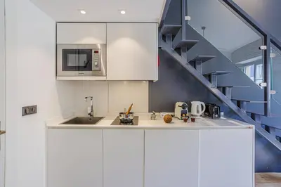 a kitchen with a sink and a microwave at MY CASA - 4 PLACE MASSENA - DUPLEX in Nice
