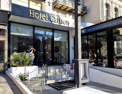 a store front of a building with a lot of windows at Hotel Carlton Nice in Nice