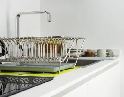a dish drying rack on a kitchen shelf at MY CASA - 48 GIOFFREDO - NEAR PLACE MASSENA in Nice