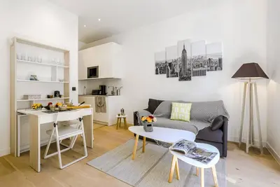 a living room with a couch and a table at MY CASA - 48 GIOFFREDO - NEAR PLACE MASSENA in Nice