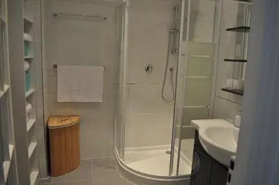 a bathroom with a shower and a sink at Appartement carre d'or in Nice