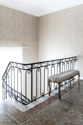 a bench sitting in the corner of a room at Stunning seaview villa. Villefranche Sur Mer in Villefranche-sur-Mer