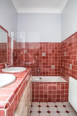 a red tiled bathroom with two sinks and a tub at Stunning seaview villa. Villefranche Sur Mer in Villefranche-sur-Mer