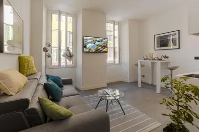 a living room with a couch and a table at MY CASA - PAULE - Great Old Town Studio w AC in Nice