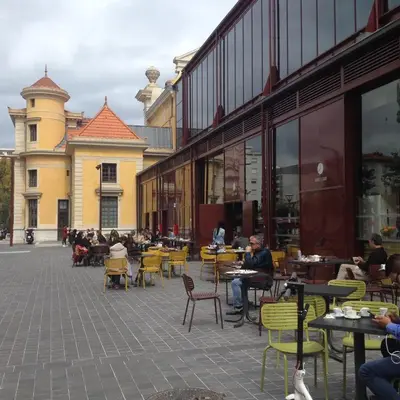 a courtyard with tables and chairs and a building at Appartement Terrasse Quartier Liberation in Nice