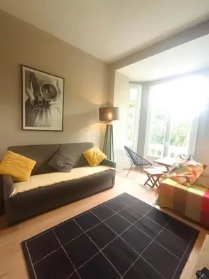 a living room with a couch and a table at Dreamplace in Nice
