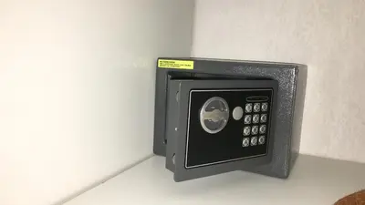 a black safe is attached to a wall at Superbe Studio in Nice at 450m from the sea with Clim in Nice