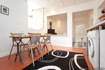 a kitchen and dining room with a table and chairs at Beach, Pure Centre, view over Opera de Nice in Nice