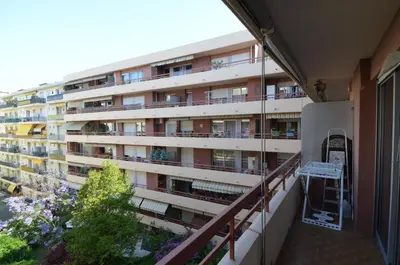 an apartment building viewed from the balcony of a building at SIENA - Appartement 6 personnes avec Terrasse et Jacuzzi plein cœur centre-ville quartier du Port de Nice in Nice