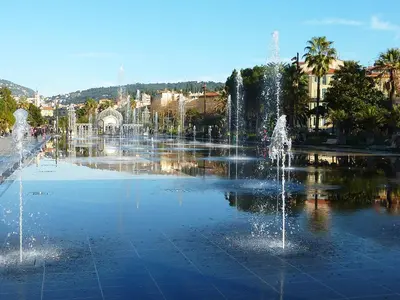 a group of fountains in a fountain in a city at 