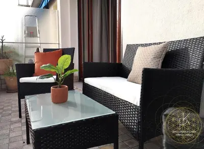 a living room with a couch and a table at Appartement Carré d'Or Vue sur Mer in Nice