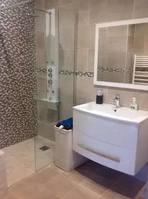 a bathroom with a sink and a shower at La Lanterne Plage in Nice
