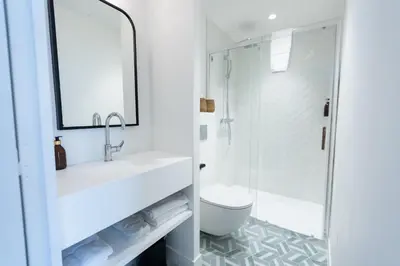 a bathroom with a shower and a sink and a toilet at Maison Durante in Nice