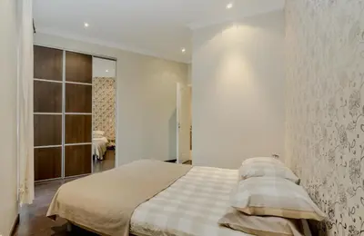 a living room with a table and a couch at Apartment with parking in Nice near the harbor in Nice