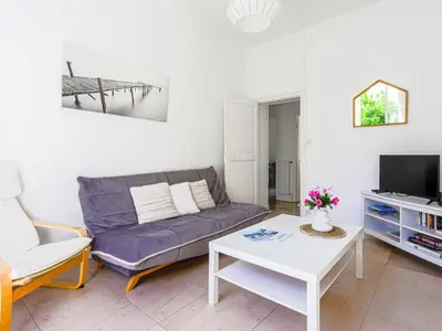 a living room with a couch and a coffee table at Apartment Hérold-1 by Interhome in Nice