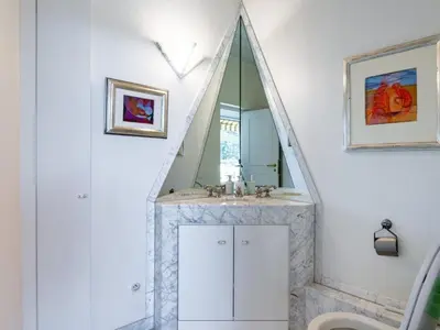 a bathroom with a mirror and a sink at Apartment Les Balcons d'Eze-1 by Interhome in Èze