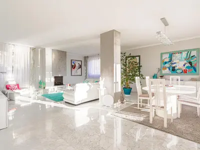 a white living room with a table and chairs at Apartment Les Balcons d'Eze-1 by Interhome in Èze