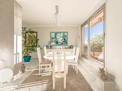 a dining room with a white table and chairs at Apartment Les Balcons d'Eze-1 by Interhome in Èze