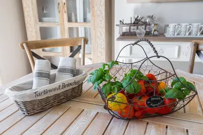 a basket of fruit sitting on top of a table at Le Corot in Beaulieu-sur-Mer