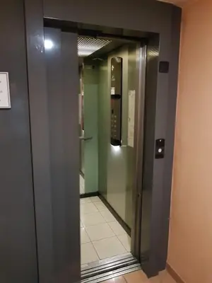 an elevator in a building with a phone at Studio With Swimming Pool 80 meters near the beach in Nice