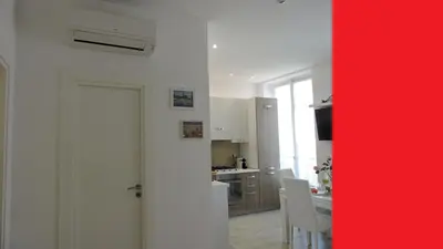 a bed with four pillows in a room at NICE FRANCE Apartment 2 rooms max 4 persons in Nice