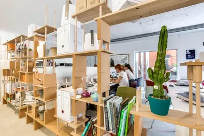a room filled with bookshelves and a cactus at Hotel du Pin Nice Port in Nice