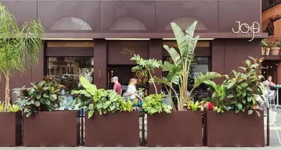 a group of plants in front of a building at Hotel du Pin Nice Port in Nice