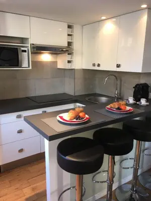 a kitchen with two plates of food on a counter at Charme Méditerranéen Votre pied à terre au Cœur du Port de Nice in Nice