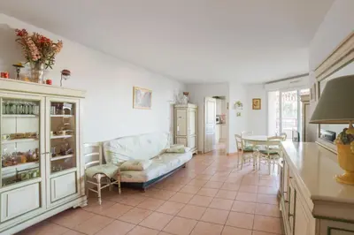 a living room with a couch and a table at Appartement Lanterne Welkeys in Nice