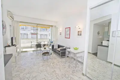 a living room with a couch and a table at PROMENADE HOLIDAY - PALATIN & SEA in Nice