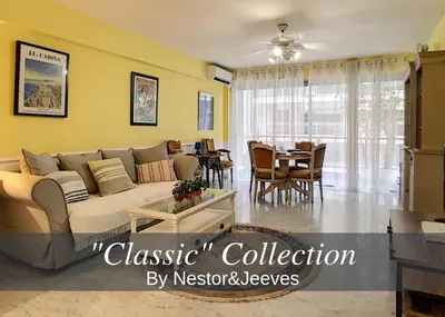 a living room with a couch and a dining room at Nestor&Jeeves - DEBUSSY TERRASSE - Central - By shopping area in Nice