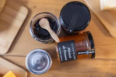 a table with a bottle of jam and a spoon at Maison Lamartine - Nice in Nice