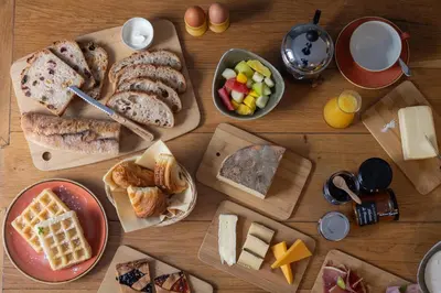 a wooden table topped with lots of different types of food at Maison Lamartine - Nice in Nice