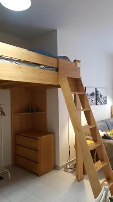 a bunk bed with a ladder in a room at Nice France in Nice