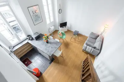 an overhead view of a living room with a table and chairs at Nicelidays - Le Suede - Carré d'or - 2min from beaches in Nice