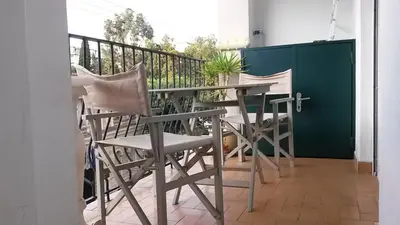 a table and chairs sitting on a balcony at Les Grands Cedres D3 in Nice