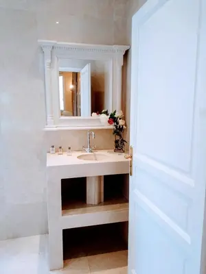 a bathroom with a sink and a mirror at Semiramis in Villefranche-sur-Mer