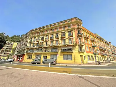 a yellow building on the side of a street at PROMENADE HOLIDAY - ROCAMARE PROMENADE in Nice