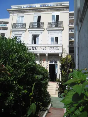 a white building with a balcony on top of it at Villa Eden in Nice