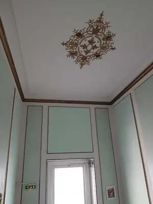 a coffered ceiling with a chandelier above a door at Villa Eden in Nice